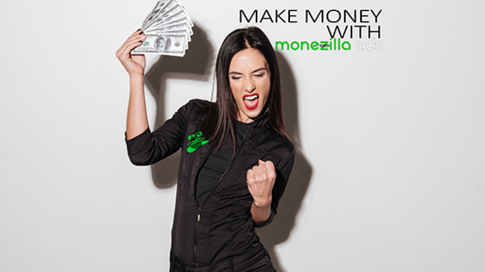 Photo of young happy woman with red lips standing isolated over white wall. Looking aside holding money make winner gesture.
